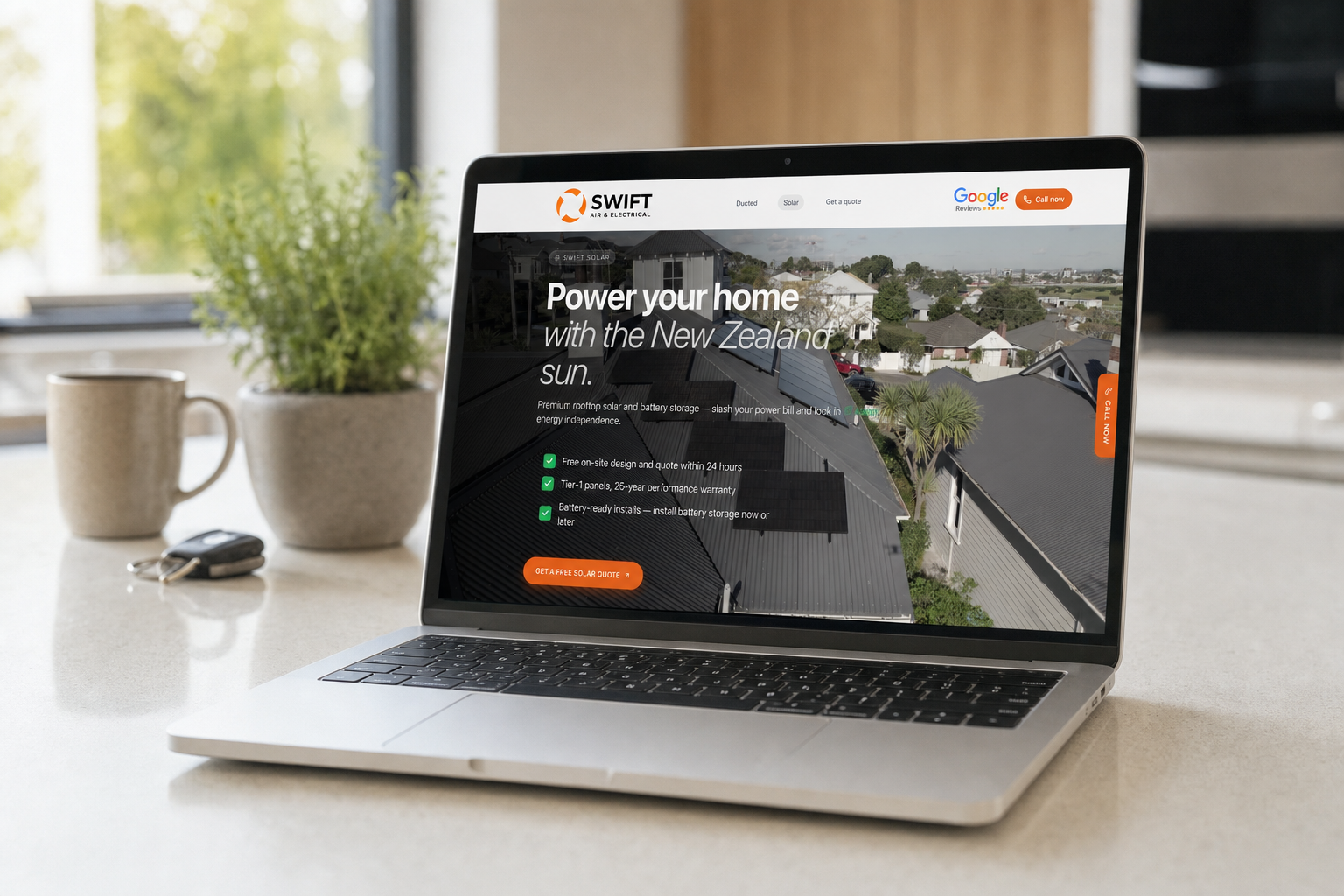 A tradie's website shown on a laptop on a kitchen counter